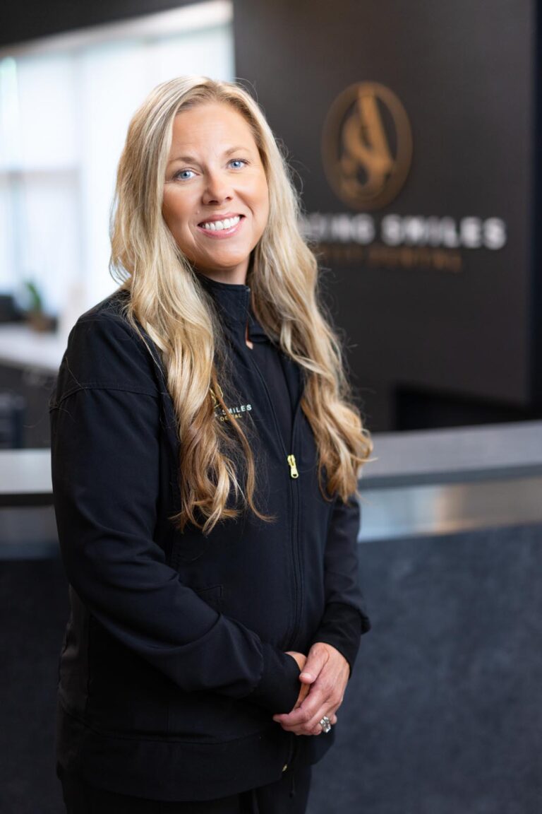 Inga Hygienist headshot at Amazing Smiles lobby. Smiling and wearing black scrub suitDr. Emily Hoang headshot at Amazing Smiles lobby. Smiling and wearing black scrub suit