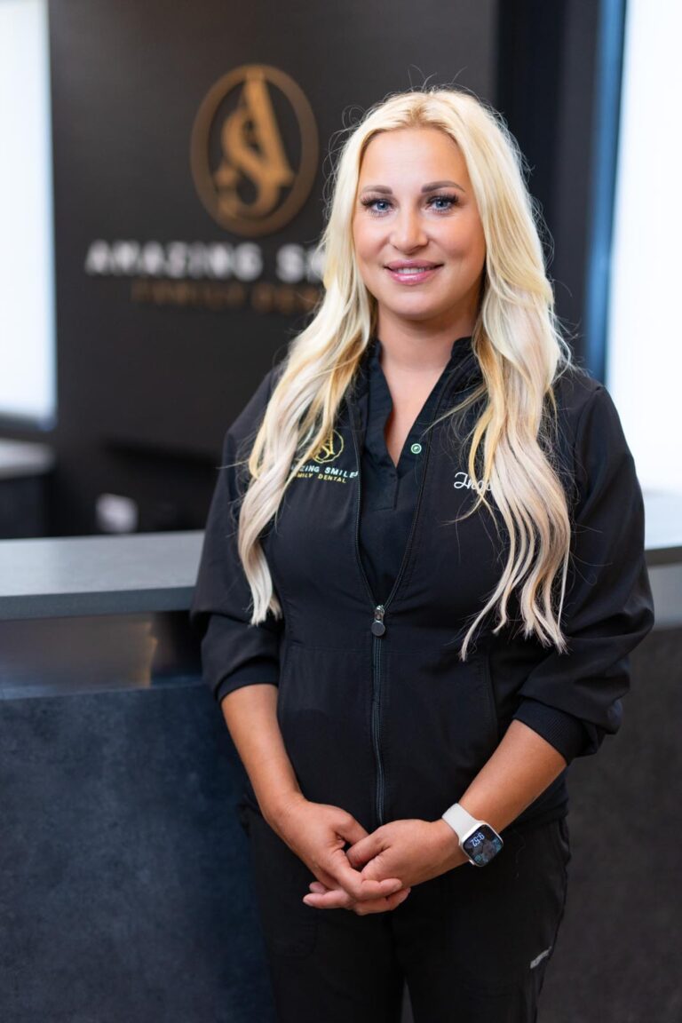 Inga Z Hygienist headshot at Amazing Smiles lobby. Smiling and wearing black scrub suitDr. Emily Hoang headshot at Amazing Smiles lobby. Smiling and wearing black scrub suit