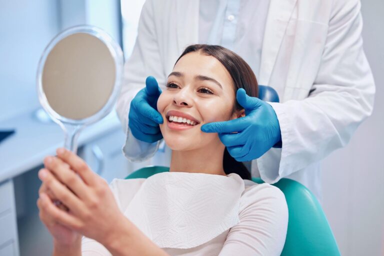 Shot of a young woman checking her dental implants results in the dentist's office sitting on a dental chair